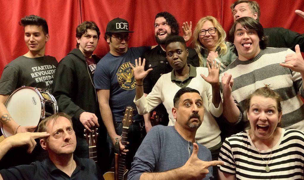 Back row: Gerrod, Mike, Cecil, Christian, Linda, and Phil. Middle row: Ritah and Micah. Front row: Michael, Neel, and Vanessa. Whew!