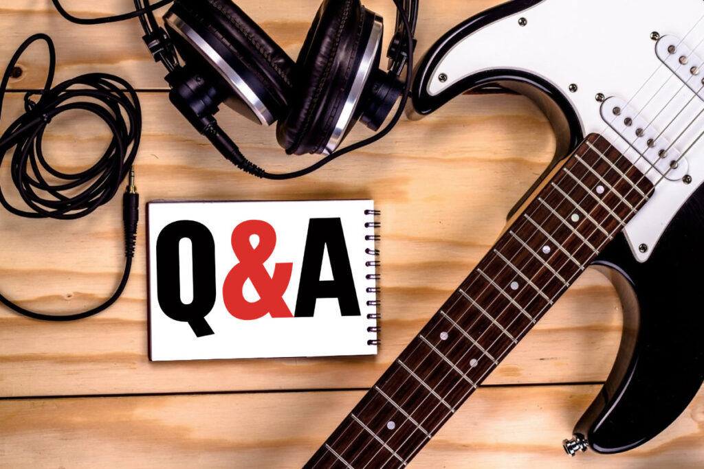 Q&A in a book with a guitar and headphones