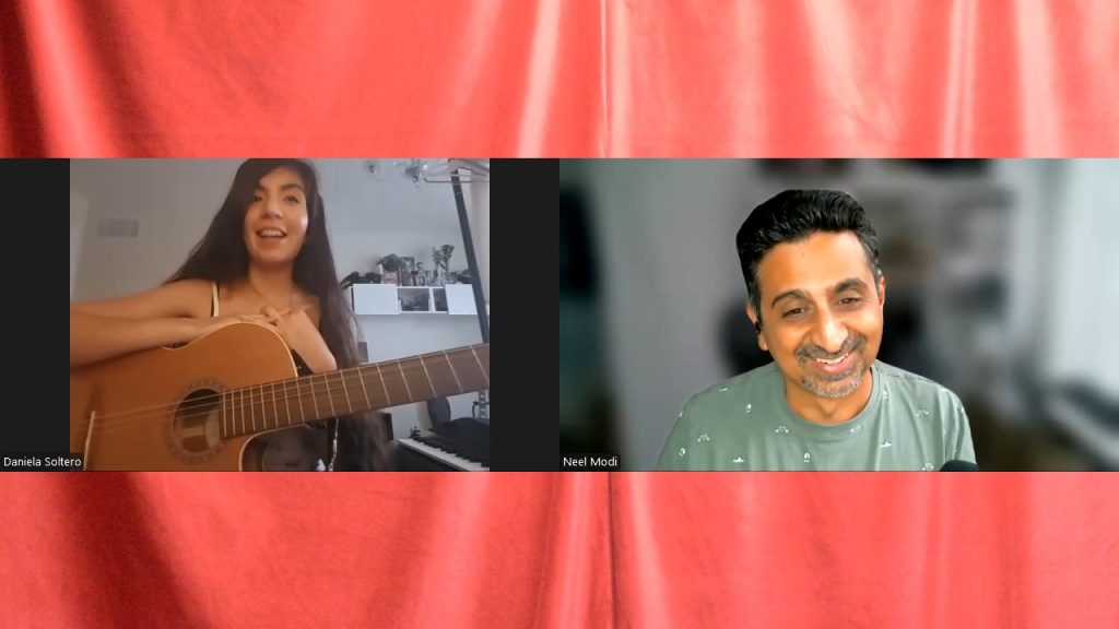 Daniela with her acoustic guitar and Neel on a Zoom call